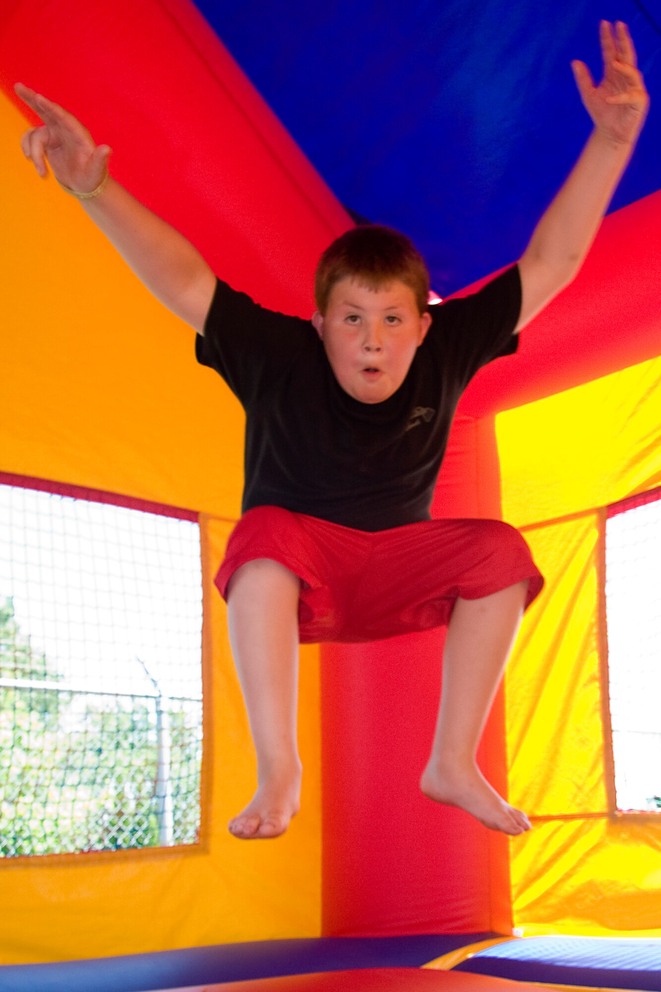 GRISSOM AIR RESERVE BASE, Ind. -- A young boy takes his turn jumping around in a bounce castle setup at this year's Family Appreciation Day picnic held during the July unit training assembly. Each year the 434th Air Refueling Wing thanks families for their support of reservists and base personnel during a picnic featuring displays, games and family activities. (U.S. Air Force photo/Tech. Sgt. Mark R. W. Orders-Woempner)

