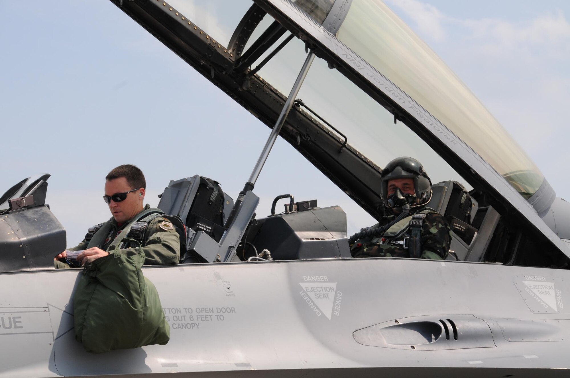 Capt. Steve Strandburg, from the Alabama Air National Guard prepares to fly Lt. Gen. Serhiy Onyschenko in an Air National Guard F-16D Fighting Falcon for an orientation flight at Mirgorod Air Base, Ukraine, July 22, during Safe Skies 2011. (U.S. Air Force photo by Maj. Matthew T. Mutti)
