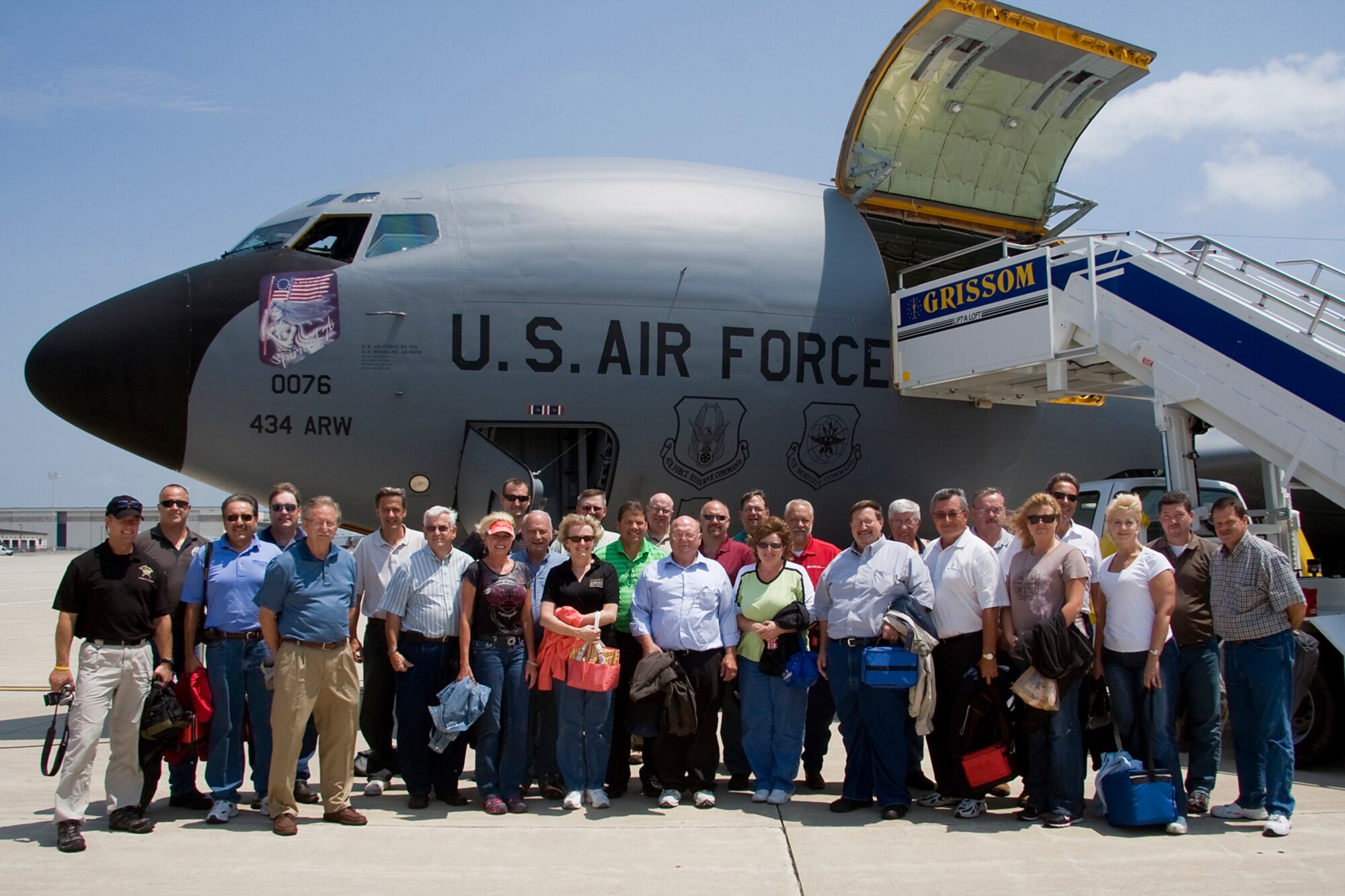 GRISSOM AIR RESERVE BASE, Ind. -- Local civic leaders pose for a photo after returning from an aerial refueling mission onboard one of the 434th Air Refueling Wing's KC-135R Stratotankers during an orientation flight July 20. During the flight, the civic leaders, which represented a number of areas including Fort Wayne, Peru, Converse, Denver and Kokomo, were able to witness first-hand the mission of the 434th ARW as the crew refueled an E-3 Sentry from Tinker Air Force Base, Okla. Orientation flights are just one part of the 434th ARW's community outreach program. (U.S. Air Force photo/Tech. Sgt. Mark R. W. Orders-Woempner)
