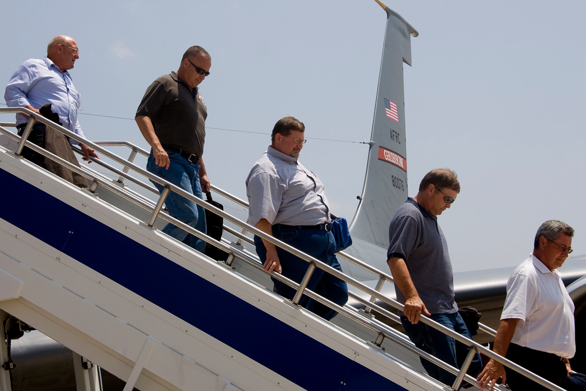GRISSOM AIR RESERVE BASE, Ind. -- Local civic leaders return to Grissom after taking flight on one of the 434th Air Refueling Wing's KC-135R Stratotankers during an orientation flight July 20. During the flight, the civic leaders, which represented a number of areas including Fort Wayne, Peru, Converse, Denver and Kokomo, were able to witness first-hand the mission of the 434th ARW as the crew refueled an E-3 Sentry from Tinker Air Force Base, Okla. Orientation flights are just one part of the 434th ARW's community outreach program. (U.S. Air Force photo/Tech. Sgt. Mark R. W. Orders-Woempner)
