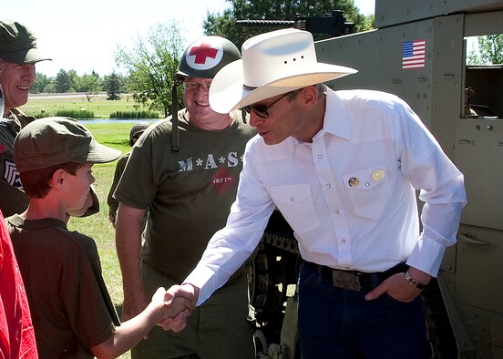 Air Force Chief of Staff Gen. Norton Schwartz talks with Spencer Hicklin about his participation in a World War II reenactment during Fort D. A. Russell Days  July 23, 2011, held at F. E. Warren Air Force Base, Wyo. (U.S. Air Force photo/Matt Bilden)
