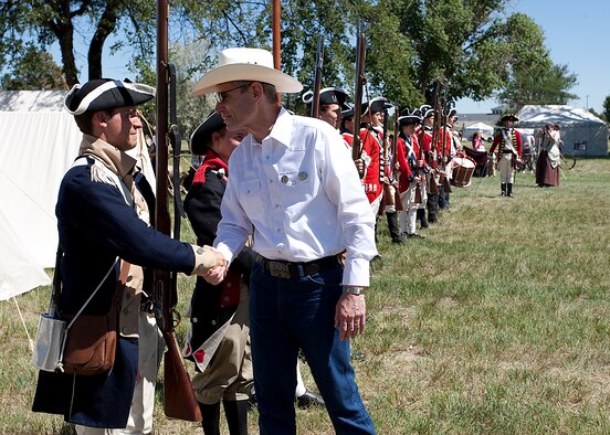 Air Force Chief of Staff Gen. Norton Schwartz thanks Andy W. Patterson for his participation in a military reenactment during Fort D. A. Russell Days July 23, 2011, held at F. E. Warren Air Force Base, Wyo. (U.S. Air Force photo/Matt Bilden)