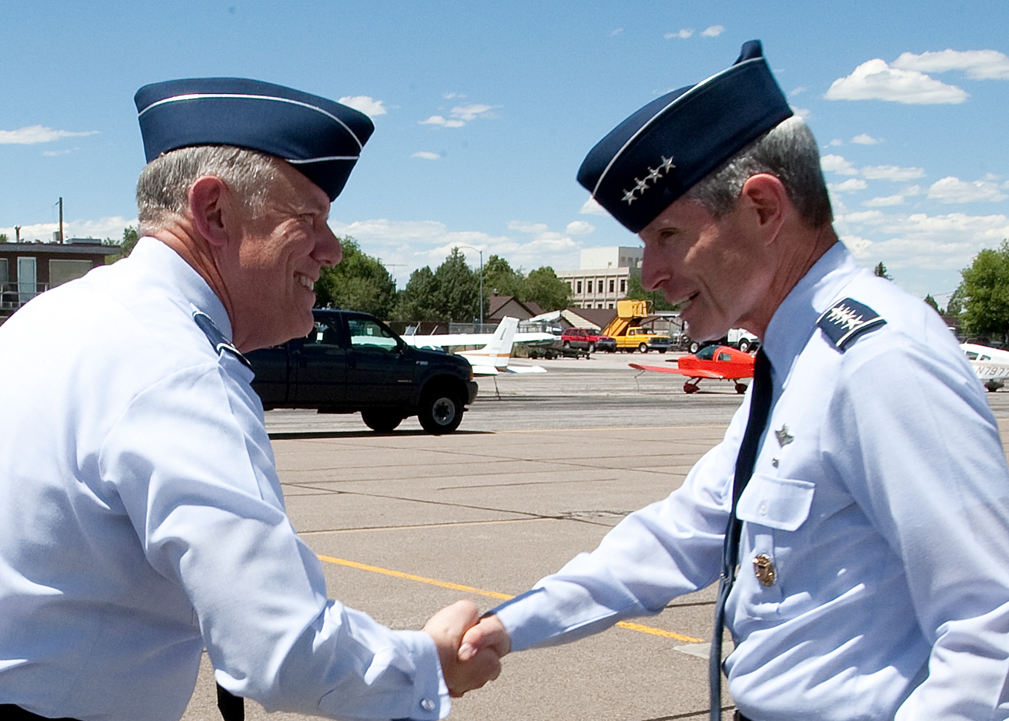 Air Force Chief of Staff Gen. Norton Schwartz greets Maj. Gen. C. Donald Alston July 22, 2011, after arriving at Cheyenne Regional Airport, Wyo. Alston is the 20th Air Force commander. (U.S. Air Force photo/Matt Bilden)
