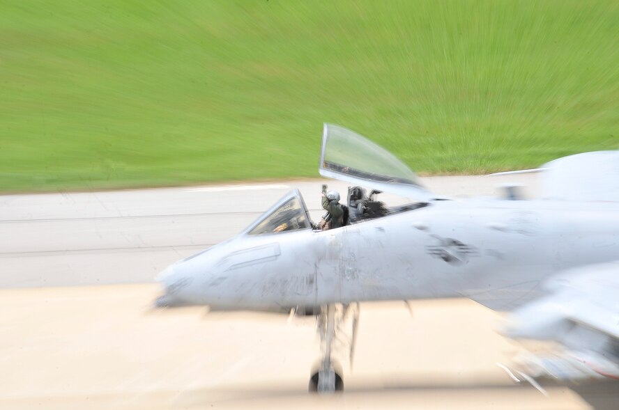 An A-10 Thunderbolt pilot, wave’s after landing from a training mission. During the mission pilots are placed up against a variety of scenarios which helps keep them ready for real world contingency. (U.S. Air Force Photos by/ Senior Airman Adam Grant