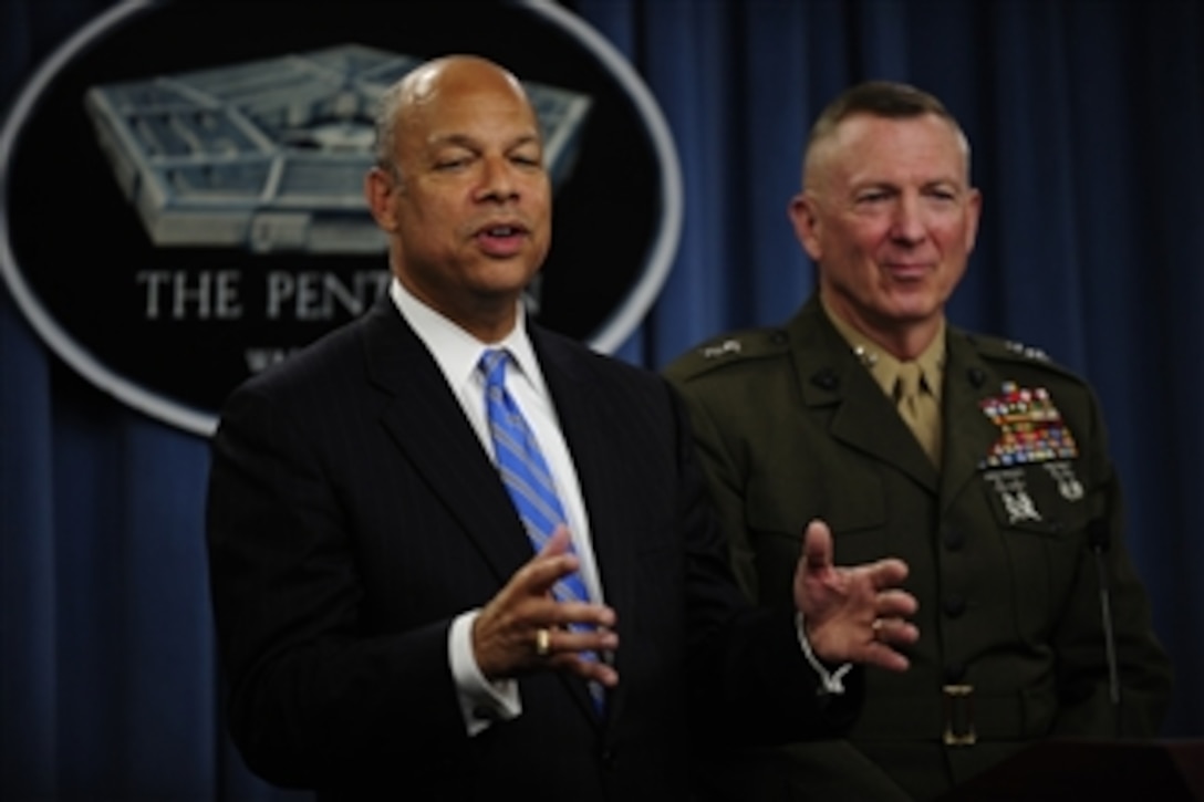 Department of Defense General Counsel Jeh Johnson makes remarks at a press conference to announce that the President, the Secretary of Defense and the Chairman of the Joint Chiefs of Staff have certified to Congress that the Services are prepared for the implementation of the repeal of 10 U.S.C. 654, the law commonly known as "Don't Ask, Don't Tell."  Chief of Staff to Military Personnel Policy Maj. Gen. Steven Hummer (right) also participated.  