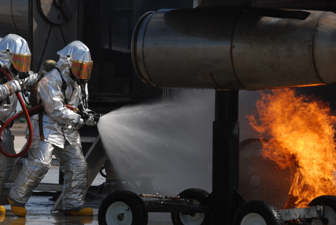 Crash, fire and rescue Marines with Marine Wing Support Squadron 471, Marine Wing Support Group 47, 4th Marine Aircraft Wing take part in training to put out fires on aircraft at the flight line at Marine Corps Air Station Yuma, Ariz., July 25. The training was conducted during exercise Javelin Thrust 2011. A C-130 Cargo Aircraft burn simulator was used to teach the CFR Marines the proper techniques used to subdue aircraft and fuel fires. “This simulator allows us to gain real-life experience and do our job as firefighters,” said Sgt. Daniel C. Puelston, a 27-year-old material noncommissioned officer from Farmington, Minn.