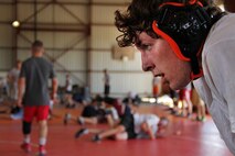 Brandon Ritter, 17, from Park Rapids, Minn., watches an All-Marine wrestler demonstrate take-down techniques during a free-style training session at the All-Marine Wrestling Camp July 26. Ritter will be a senior at Park Rapids Area High School. For additional imagery from the event, visit www.facebook.com/rstwincities.