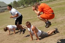 Wrestlers from Minnesota, Iowa, Wisconsin and the Dakotas conduct exercises during a strength and cardio training session at the All-Marine Wrestling Camp July 26. Recruiting Station Twin Cities hosted the six-day camp to promote academic and athletic excellence. For additional imagery from the event, visit www.facebook.com/rstwincities.