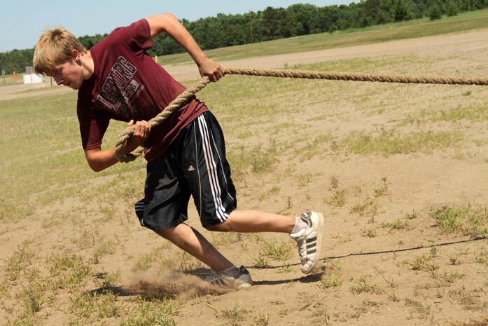 Dustin Haxton, 14, from Wabasha, Minn., runs back to the start line during a strength and cardio training session at the All-Marine Wrestling Camp July 26. Haxton will be a freshman at Zumbrota-Mazeppa High School. Recruiting Station Twin Cities hosted the six-day camp to promote academic and athletic excellence. For additional imagery from the event, visit www.facebook.com/rstwincities.