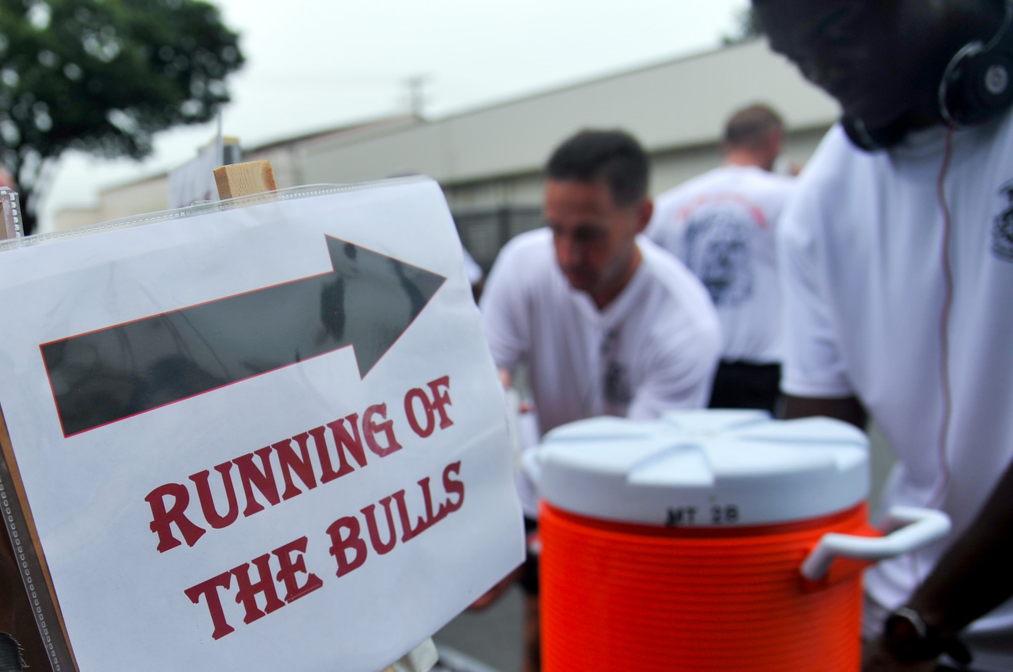 YOKOTA AIR BASE, Japan -- Airmen from the 374th Civil Engineer Squadron quench their thirst after finishing the first annual "Running of the Bulls" event at Yokota Air Base, Japan, July 27, 2011. "Running of the Bulls" is an 8-mile run held to boost squadron morale and physical fitness. (U.S. Air Force photo/Airman 1st Class Krystal M. Garrett) 