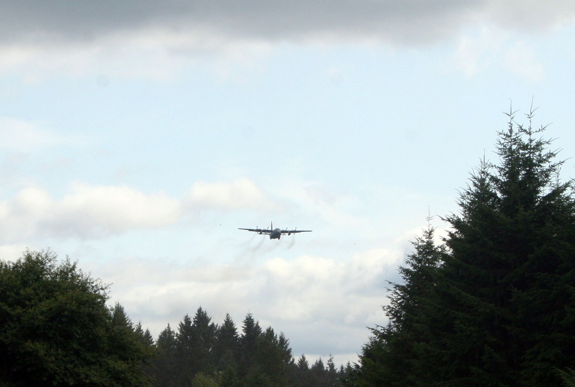 A C-130 Hercules participating in Air Mobility Rodeo 2011 returns from a competition sortie to Joint Base Lewis-McChord, Wash., on July 26, 2011. Rodeo 2011, sponsored by the Air Mobility Command, is the Mobility Air Force's readiness competition. This competition focuses on improving worldwide air mobility forces' professional core abilities. More than 150 teams and 3,000 people from the Air Force, and Air Force Reserve, as well as allied nations are participating in Rodeo. (U.S. Air Force Photo/Master Sgt. Scott T. Sturkol)