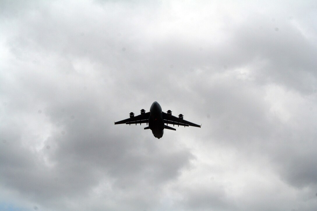 A C-17 Globemaster III participating in Air Mobility Rodeo 2011 takes off for a competition sortie to Joint Base Lewis-McChord, Wash., on July 26, 2011. Rodeo 2011, sponsored by the Air Mobility Command, is the Mobility Air Force's readiness competition. This competition focuses on improving worldwide air mobility forces' professional core abilities. More than 150 teams and 3,000 people from the Air Force, and Air Force Reserve, as well as allied nations are participating in Rodeo. (U.S. Air Force Photo/Master Sgt. Scott T. Sturkol)