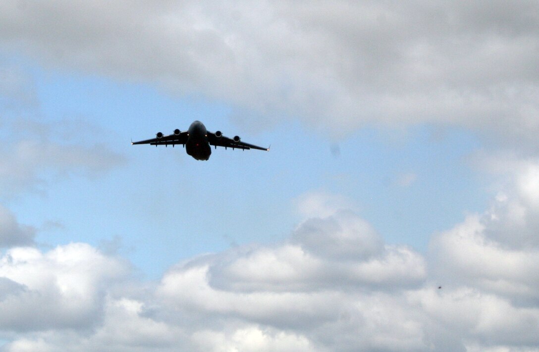 A C-17 Globemaster III participating in Air Mobility Rodeo 2011 takes off for a competition sortie to Joint Base Lewis-McChord, Wash., on July 26, 2011. Rodeo 2011, sponsored by the Air Mobility Command, is the Mobility Air Force's readiness competition. This competition focuses on improving worldwide air mobility forces' professional core abilities. More than 150 teams and 3,000 people from the Air Force, and Air Force Reserve, as well as allied nations are participating in Rodeo. (U.S. Air Force Photo/Master Sgt. Scott T. Sturkol)