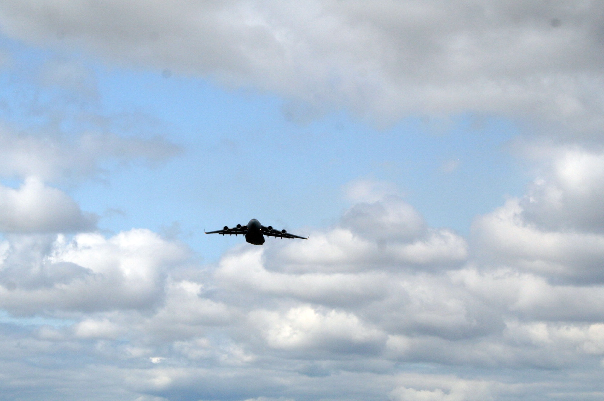 A C-17 Globemaster III participating in Air Mobility Rodeo 2011 takes off for a competition sortie to Joint Base Lewis-McChord, Wash., on July 26, 2011. Rodeo 2011, sponsored by the Air Mobility Command, is the Mobility Air Force's readiness competition. This competition focuses on improving worldwide air mobility forces' professional core abilities. More than 150 teams and 3,000 people from the Air Force, and Air Force Reserve, as well as allied nations are participating in Rodeo. (U.S. Air Force Photo/Master Sgt. Scott T. Sturkol)