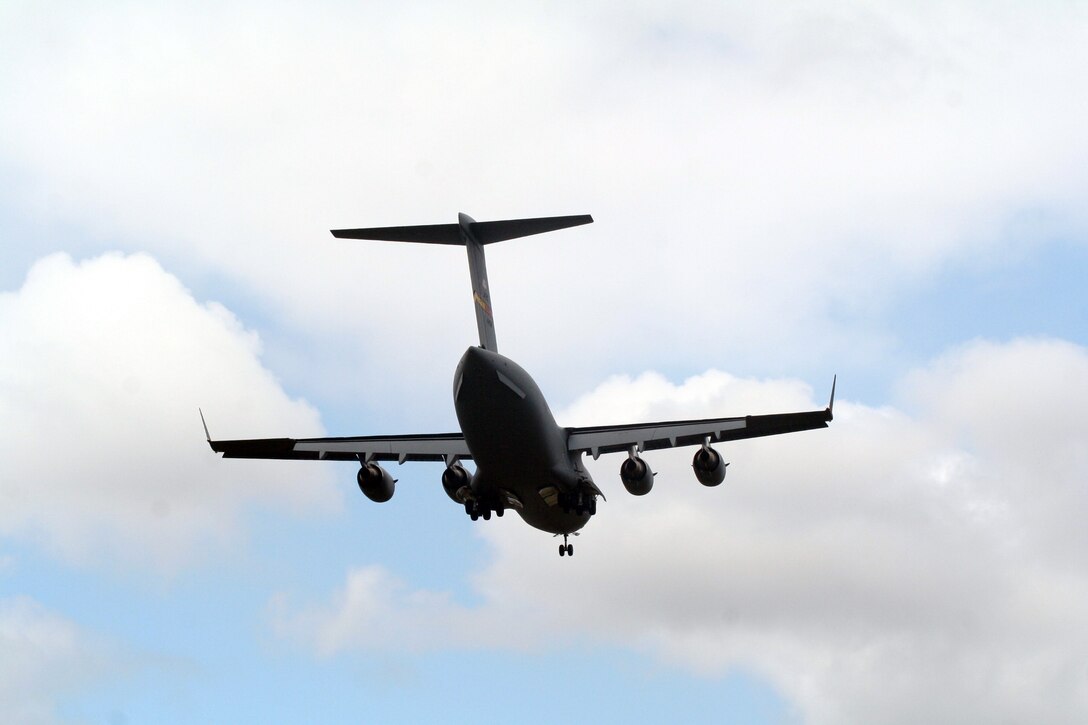 A C-17 Globemaster III participating in Air Mobility Rodeo 2011 returns from a competition sortie to Joint Base Lewis-McChord, Wash., on July 26, 2011. Rodeo 2011, sponsored by the Air Mobility Command, is the Mobility Air Force's readiness competition. This competition focuses on improving worldwide air mobility forces' professional core abilities. More than 150 teams and 3,000 people from the Air Force, and Air Force Reserve, as well as allied nations are participating in Rodeo. (U.S. Air Force Photo/Master Sgt. Scott T. Sturkol)