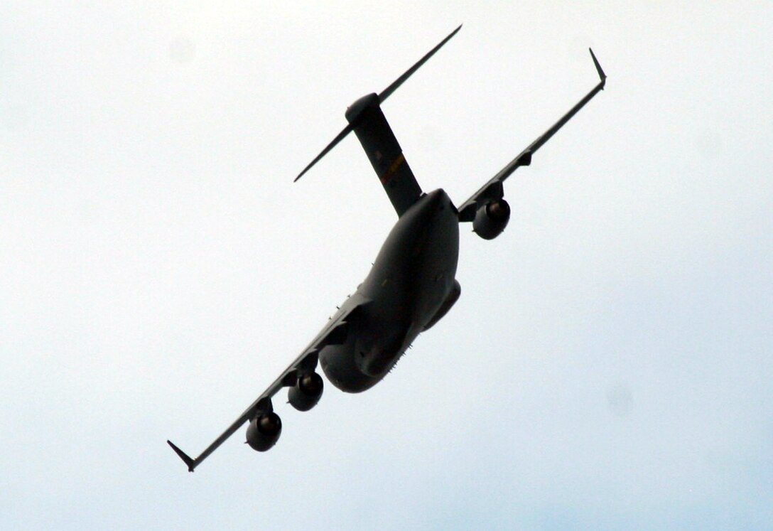 A C-17 Globemaster III participating in Air Mobility Rodeo 2011 returns from a competition sortie to Joint Base Lewis-McChord, Wash., on July 26, 2011. Rodeo 2011, sponsored by the Air Mobility Command, is the Mobility Air Force's readiness competition. This competition focuses on improving worldwide air mobility forces' professional core abilities. More than 150 teams and 3,000 people from the Air Force, and Air Force Reserve, as well as allied nations are participating in Rodeo. (U.S. Air Force Photo/Master Sgt. Scott T. Sturkol)