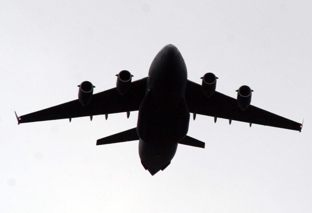 A C-17 Globemaster III participating in Air Mobility Rodeo 2011 returns from a competition sortie to Joint Base Lewis-McChord, Wash., on July 26, 2011. Rodeo 2011, sponsored by the Air Mobility Command, is the Mobility Air Force's readiness competition. This competition focuses on improving worldwide air mobility forces' professional core abilities. More than 150 teams and 3,000 people from the Air Force, and Air Force Reserve, as well as allied nations are participating in Rodeo. (U.S. Air Force Photo/Master Sgt. Scott T. Sturkol)