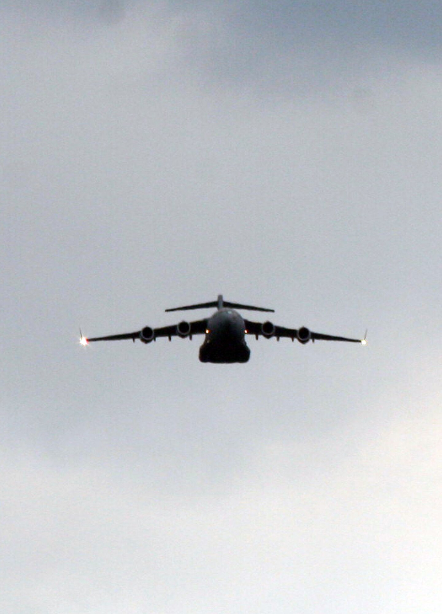 A C-17 Globemaster III participating in Air Mobility Rodeo 2011 returns from a competition sortie to Joint Base Lewis-McChord, Wash., on July 26, 2011. Rodeo 2011, sponsored by the Air Mobility Command, is the Mobility Air Force's readiness competition. This competition focuses on improving worldwide air mobility forces' professional core abilities. More than 150 teams and 3,000 people from the Air Force, and Air Force Reserve, as well as allied nations are participating in Rodeo. (U.S. Air Force Photo/Master Sgt. Scott T. Sturkol)