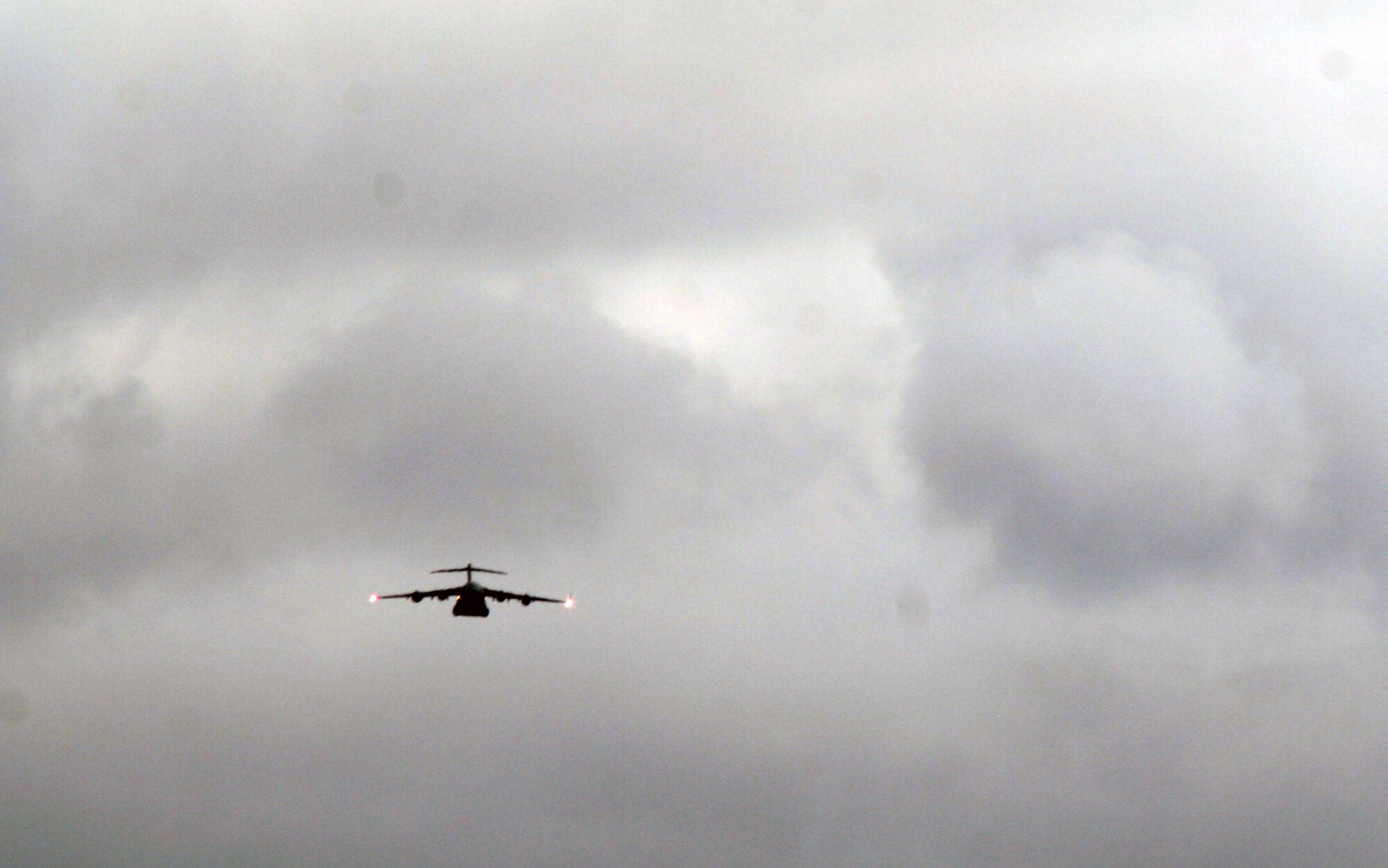 A C-130 Hercules participating in Air Mobility Rodeo 2011 returns from a competition sortie to Joint Base Lewis-McChord, Wash., on July 26, 2011. Rodeo 2011, sponsored by the Air Mobility Command, is the Mobility Air Force's readiness competition. This competition focuses on improving worldwide air mobility forces' professional core abilities. More than 150 teams and 3,000 people from the Air Force, and Air Force Reserve, as well as allied nations are participating in Rodeo. (U.S. Air Force Photo/Master Sgt. Scott T. Sturkol)