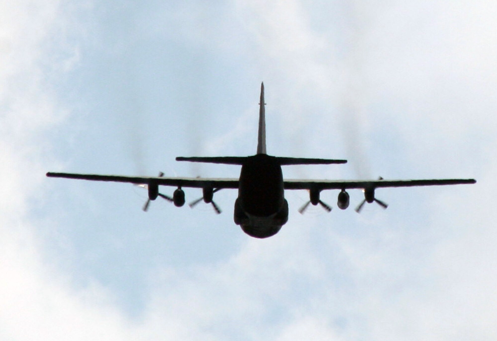 A C-130 Hercules participating in Air Mobility Rodeo 2011 returns from a competition sortie to Joint Base Lewis-McChord, Wash., on July 26, 2011. Rodeo 2011, sponsored by the Air Mobility Command, is the Mobility Air Force's readiness competition. This competition focuses on improving worldwide air mobility forces' professional core abilities. More than 150 teams and 3,000 people from the Air Force, and Air Force Reserve, as well as allied nations are participating in Rodeo. (U.S. Air Force Photo/Master Sgt. Scott T. Sturkol)