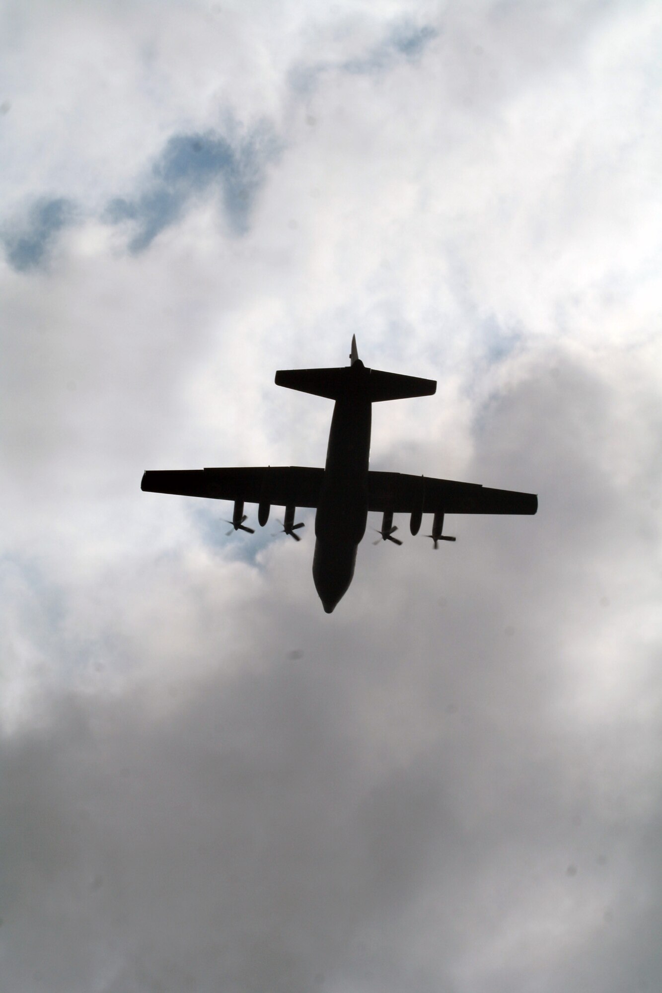 A C-130 Hercules participating in Air Mobility Rodeo 2011 returns from a competition sortie to Joint Base Lewis-McChord, Wash., on July 26, 2011. Rodeo 2011, sponsored by the Air Mobility Command, is the Mobility Air Force's readiness competition. This competition focuses on improving worldwide air mobility forces' professional core abilities. More than 150 teams and 3,000 people from the Air Force, and Air Force Reserve, as well as allied nations are participating in Rodeo. (U.S. Air Force Photo/Master Sgt. Scott T. Sturkol)