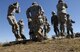 Members from the 36th Contingency Response Group here practice parachute landing postions prior to a jump during Talisman Sabre 2011. All jumpers must conduct pre-jump training prior to any jump. Talisman Sabre 2011 is an exercise designed to train U.S. and Australian forces to plan and conduct combined task force operations to improve combat readiness and interoperability on a variety of missions from conventional conflict to peacekeeping and humanitarian efforts. (Photo by Sara Csurilla)