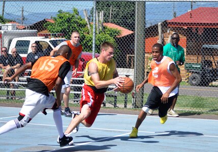 Joint Task Force-Bravo members square of at a basketball game during an organization day July 22, 2011 at Soto Cano Air Base, Honduras. The purpose of the event was to provide team building between U.S. and Honduran military and civilians. The events of the day began with a two-mile run and included a triathlon, soccer, volleyball, water volleyball, basketball, dodge ball, a litter carry competition and funny dive. (U.S. Air Force photo/Mr. Martin Chahin)