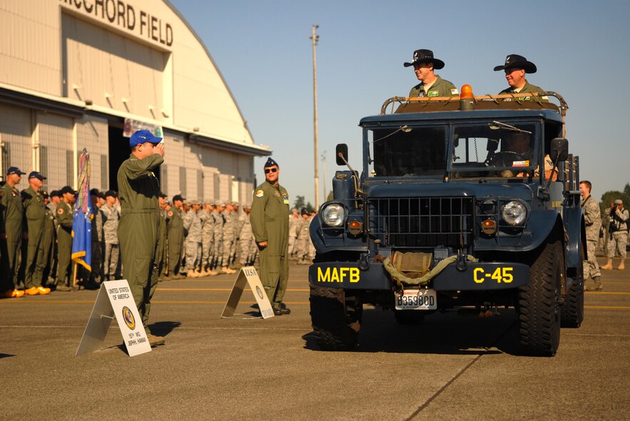 Gen. Raymond Johns, Jr., the Air Mobility Command commander, and Brig. Gen. Rick Martin, the 2011 AMC Rodeo commander, pass and review Team Hickam and international competitors July 24 during opening ceremonies at Joint Base Lewis-McChord, Wash. Team Hickam is comprised of members of the 15th Wing, 154th Wing, 515th Air Mobility Operations Wing, 624th Regional Support Group, and 647th Air Base Group. (U.S. Air Force photo/Staff Sgt. Carolyn Herrick) 