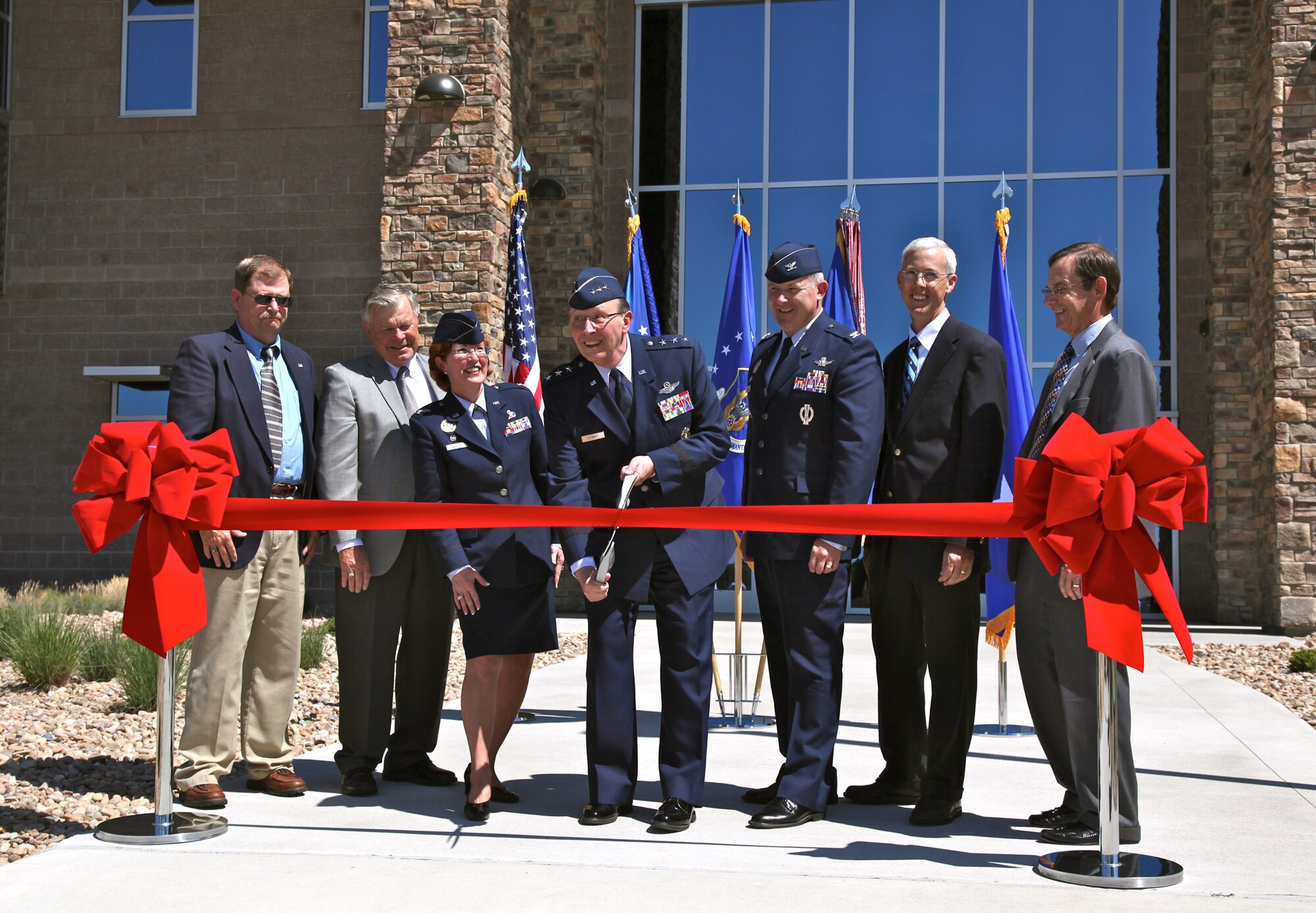 Senior leadership and community partners participated in the official ribbon cutting for the new Air Reserve Personnel Center at Buckley Air Force Base July 19. (From left) Mark Ringenberg, U.S. Army Corps of Engineers Louisville District project manager, John Sampson, president of Sampson Construction, Col. Pat Blassie, ARPC commander, Lt. Gen. Charles E. Stenner, commander of Air Force Reserve Command, Col.  Dan Dant, 460th Space Wing commander, Robert Michaels, U.S. Army Corps of Engineers chief of Construction Division Omaha District, and Art Austin, Frankfurt Short Bruza Architects and Engineers project principal. (U.S. Air Force photo/ Quinn Jacobson, ARPC/PA)