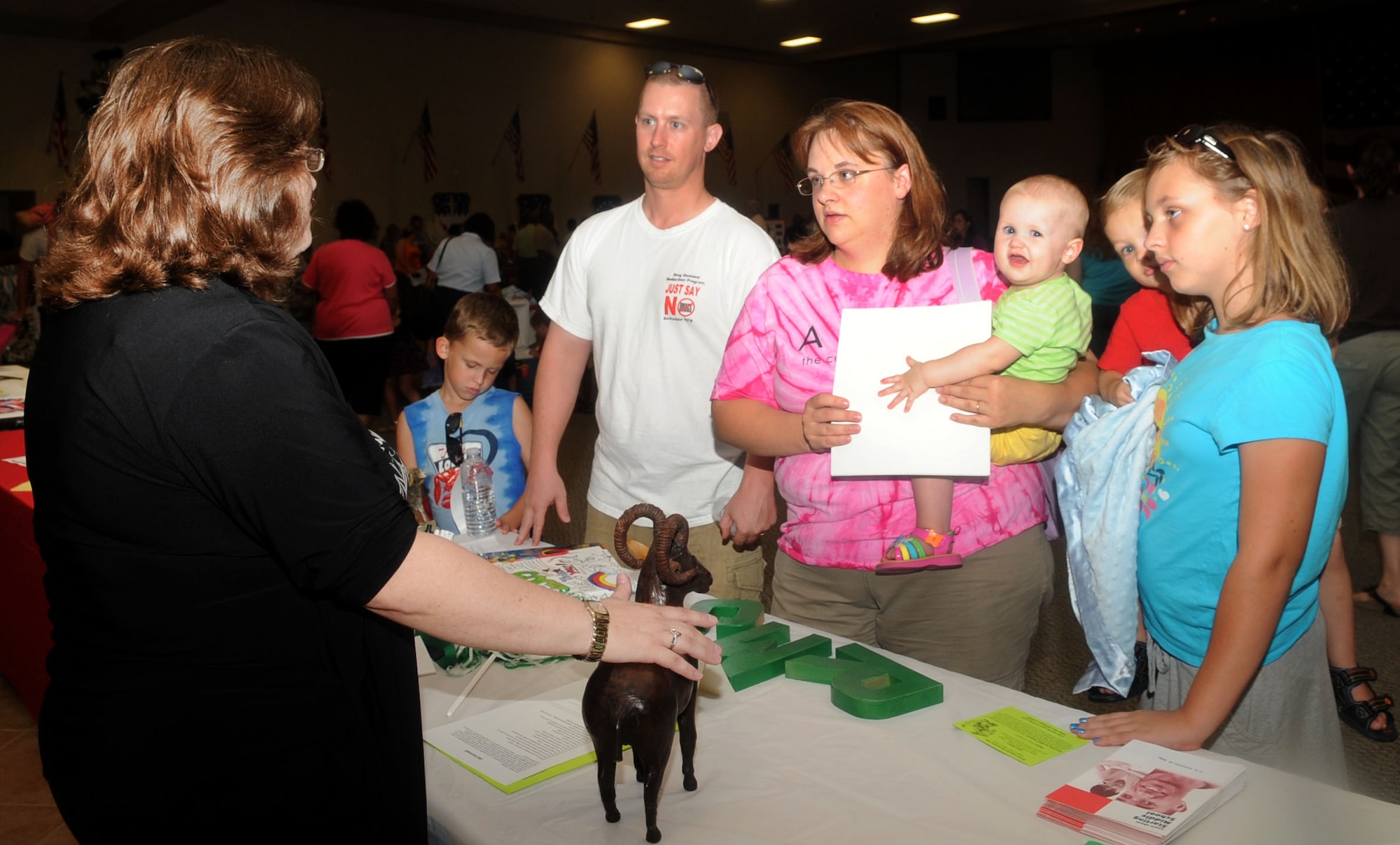 Staff Sgt. Albert Hunsiker, 2nd Force Support Squadron, and his wife Beth speak with Shona Duche, counselor for Rusheon Middle School in Bossier Parish, at the Back to School night at Hoban Hall on Barksdale Air Force Base, La., July 25. The event provided parents an opportunity to speak with school officials from the community. (U.S. Air Force photo/Senior Airman Kristin High)(RELEASED)