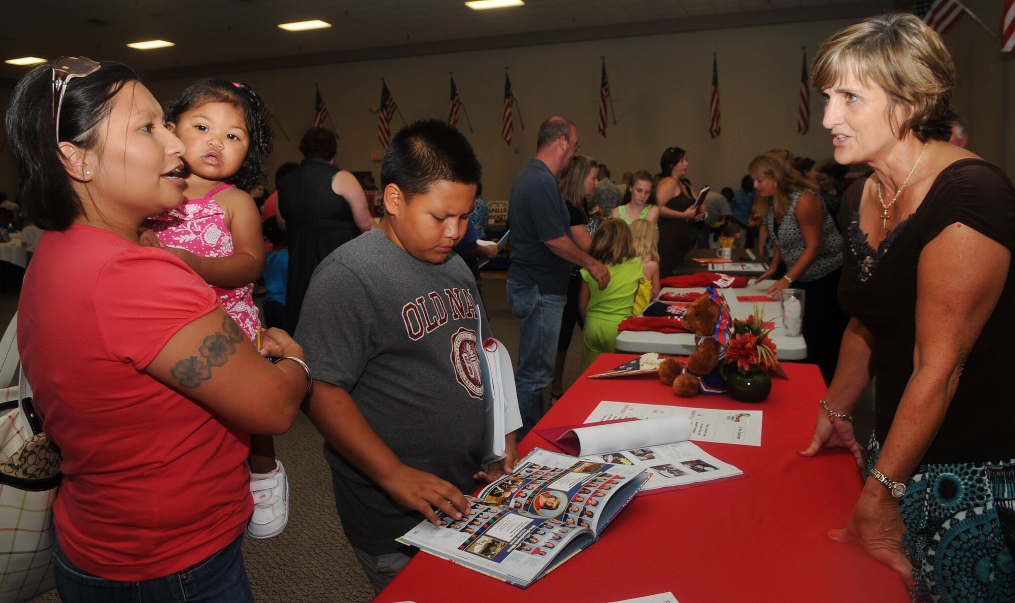 Tech. Sgt. Yvonne Dees, Barksdale Airman Leadership School instructor, speaks with Nancy Doerner, principal of Princeton Elementary school in Caddo Parish, at Back to School night at Hoban Hall on Barksdale Air Force Base, La., July 25. The event provided parents an opportunity to speak with school officials from the community about the different schools and the programs offered. (U.S. Air Force photo/Senior Airman Kristin High)(RELEASED)
