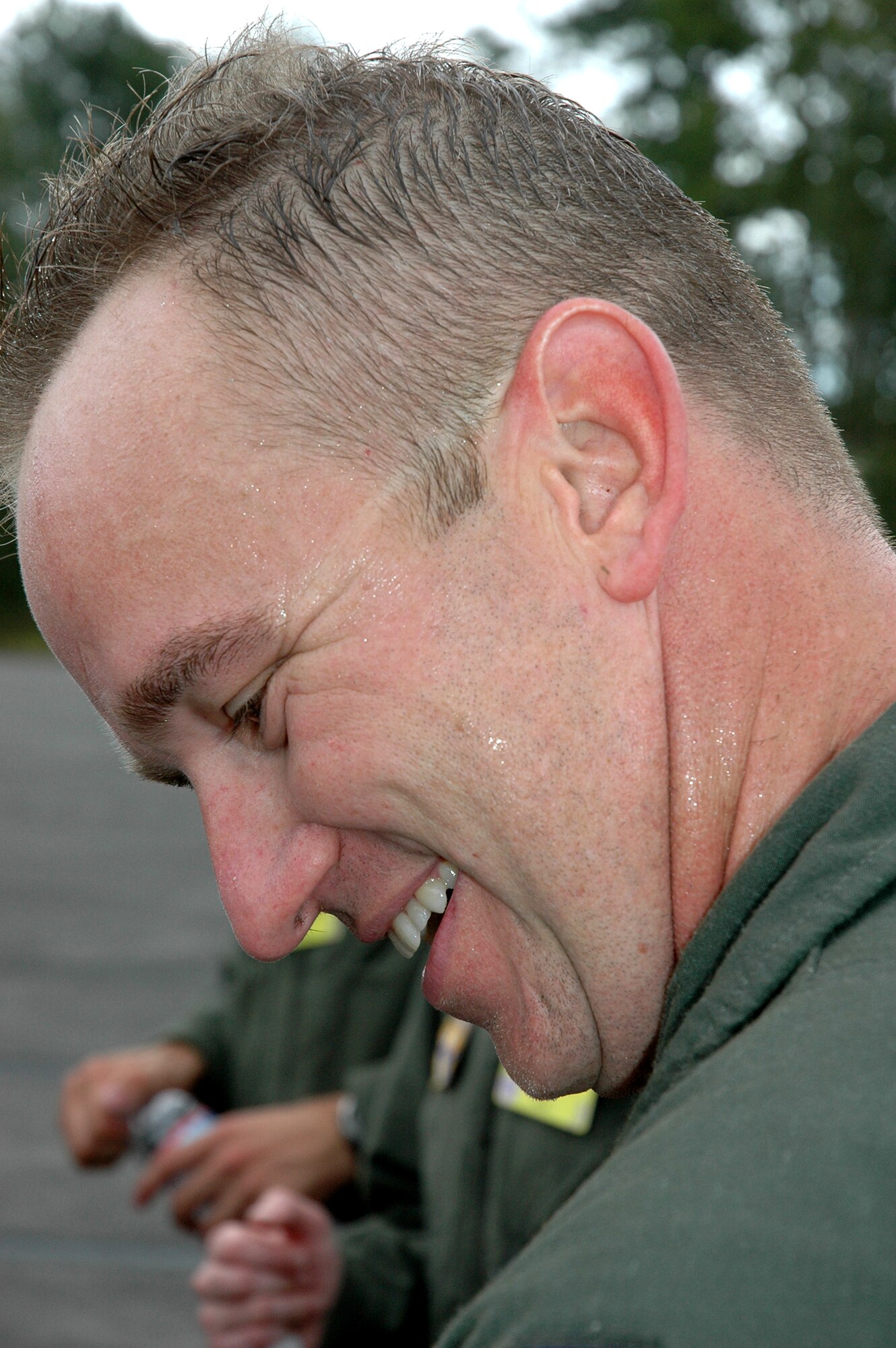 Capt. Jason Cross, 446th Airlift Wing Rodeo aeromedical evacuation team, laughs with relief after his team completed the KC-135 static aeromedical configuration competition July 26 during Air Mobility Command's Rodeo at McChord Field, Wash.  (U.S. Air Force photo by Sandra Pishner)