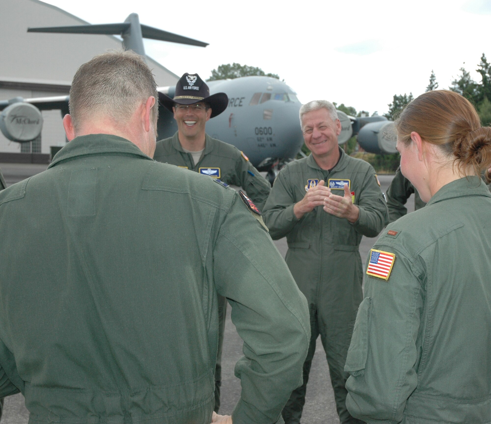 Col. Bruce Bowers, 446th Airlift Wing commander (third from left), congratulates the wing's Rodeo aeromedical evacuation team after they completed the KC-135 aeromedical configuration event July 26 during Air Mobility Command's Rodeo at McChord Field, Wash. (U.S. Air Force photo by Sandra Pishner)