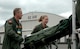 Capt. Jason Cross, left, and Senior Airman Krystal Reinstadler enjoy the cheers from spectators as their 446th Airlift Wing Rodeo aeromedical evacuation team competes in the KC-135 static aeromedical configuration event July 26 during Air Mobility Command's Rodeo at McChord Field, Wash.  (U.S. Air Force photo by Sandra Pishner)