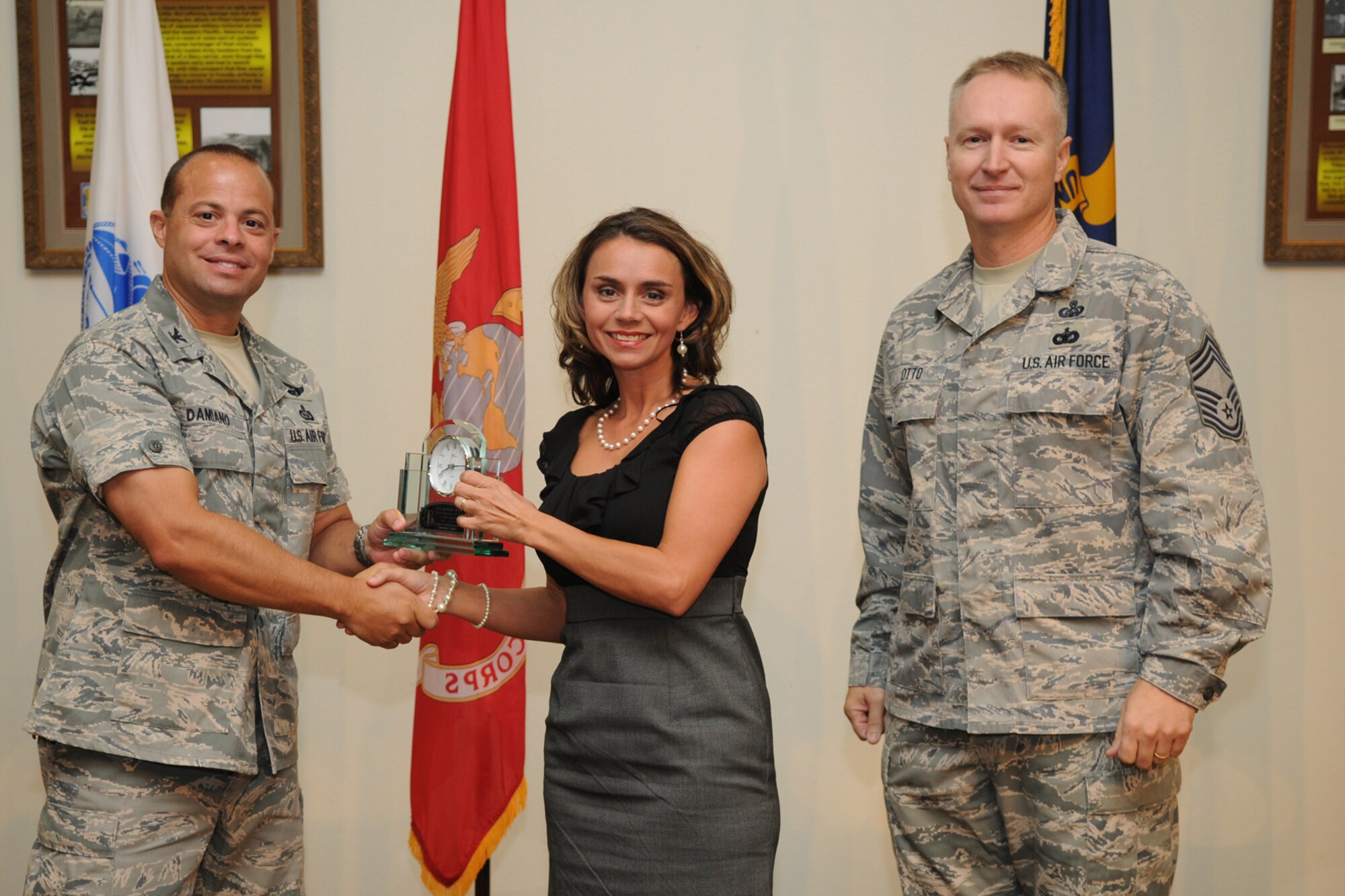 GOODFELLOW AIR FORCE BASE, Texas -- Col. Mark Damiano, 17th Training Wing Commander, and Chief Master Sgt. Quinton Otto, 17th Mission Support Group Superintendent, present the 17th Training Wing Civilian Supervisor of the Quarter Category Two to Donna Casey, 17th Training Wing, during the quarterly awards breakfast July 26 at the Event Center here.  (U.S. Air Force photo/Senior Airman Heather L. Rodgers)
