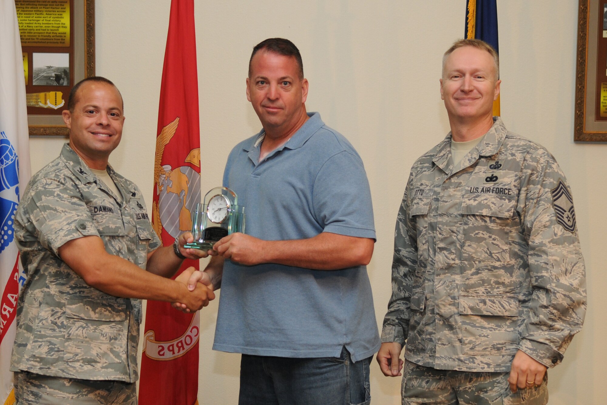 GOODFELLOW AIR FORCE BASE, Texas -- Col. Mark Damiano, 17th Training Wing Commander, and Chief Master Sgt. Quinton Otto, 17th Mission Support Group Superintendent, present the 17th Training Wing Civilian Supervisor of the Quarter Category One to Edward R. Ford, 17th Mission Support Group, during the quarterly awards breakfast July 26 at the Event Center here.  (U.S. Air Force photo/Senior Airman Heather L. Rodgers)
