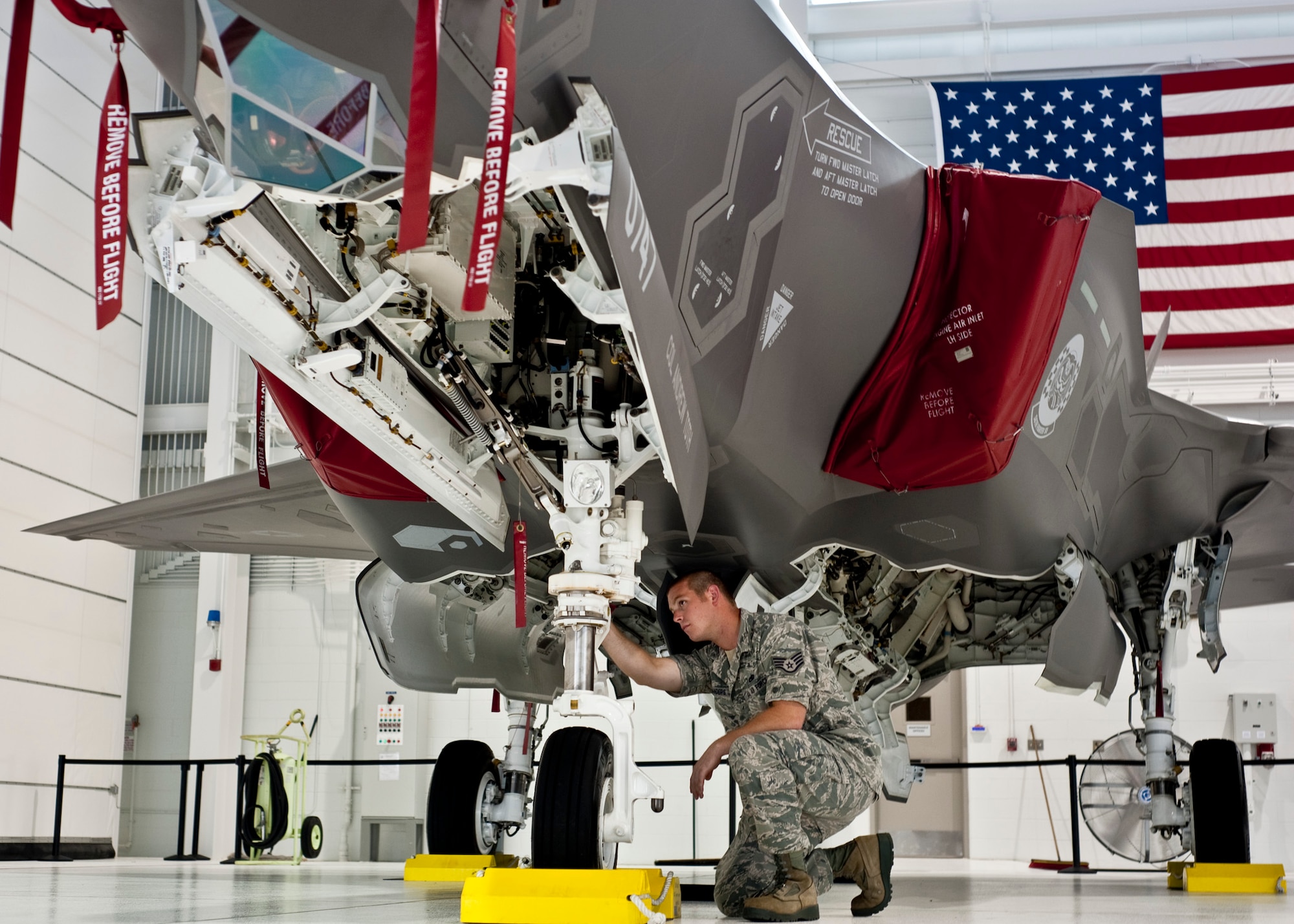 Staff Sgt. Michael Sanders, of the 58th Aircraft Maintenance Squadron checks out the first F-35 Lightning II joint strike fighter at Eglin Air Force Base, Fla.  The first JSF arrival also marked Sanders first time ever recovering an aircraft.  (U.S. Air Force photo/Chrissy Cuttita)