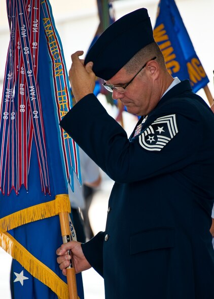 New 53rd Wing command chief, Chief Master Sgt. John Milam, makes a last minute cap adjustment before the wing’s change of command ceremony at Eglin Air Force Base, Fla., July 26.  Col. David Hicks took command of the wing from Col. Michael Gantt.  (U.S. Air Force photo/Samuel King Jr.)