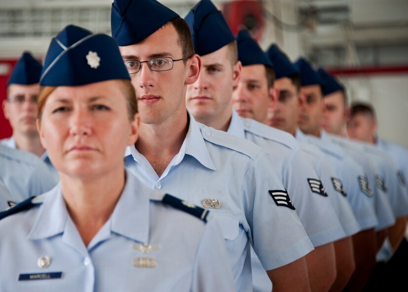 A formation of Airmen, from the 53rd Electronic Warfare Group, stand at parade rest prior to the 53rd Wing change of command ceremony at Eglin Air Force Base, Fla., July 26.  Col. David Hicks took command of the wing from Col. Michael Gantt.  (U.S. Air Force photo/Samuel King Jr.)