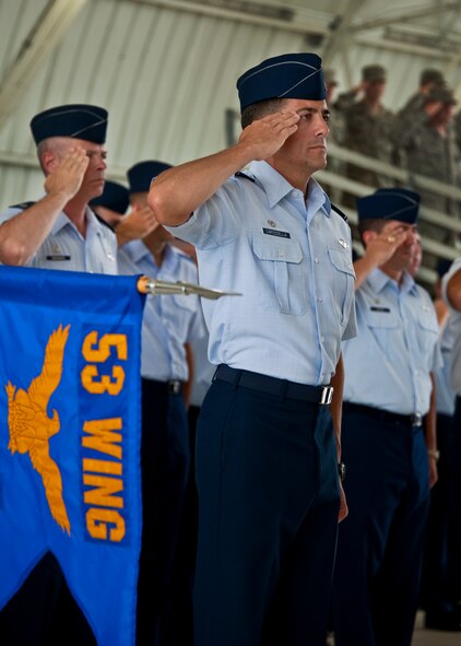 Col. Robert Capozzella, the 53rd Test Management Group commander, salutes during the national anthem at the 53rd Wing change of command ceremony at Eglin Air Force Base, Fla., July 26.  Col. David Hicks took command of the wing from Col. Michael Gantt.  (U.S. Air Force photo/Samuel King Jr.)