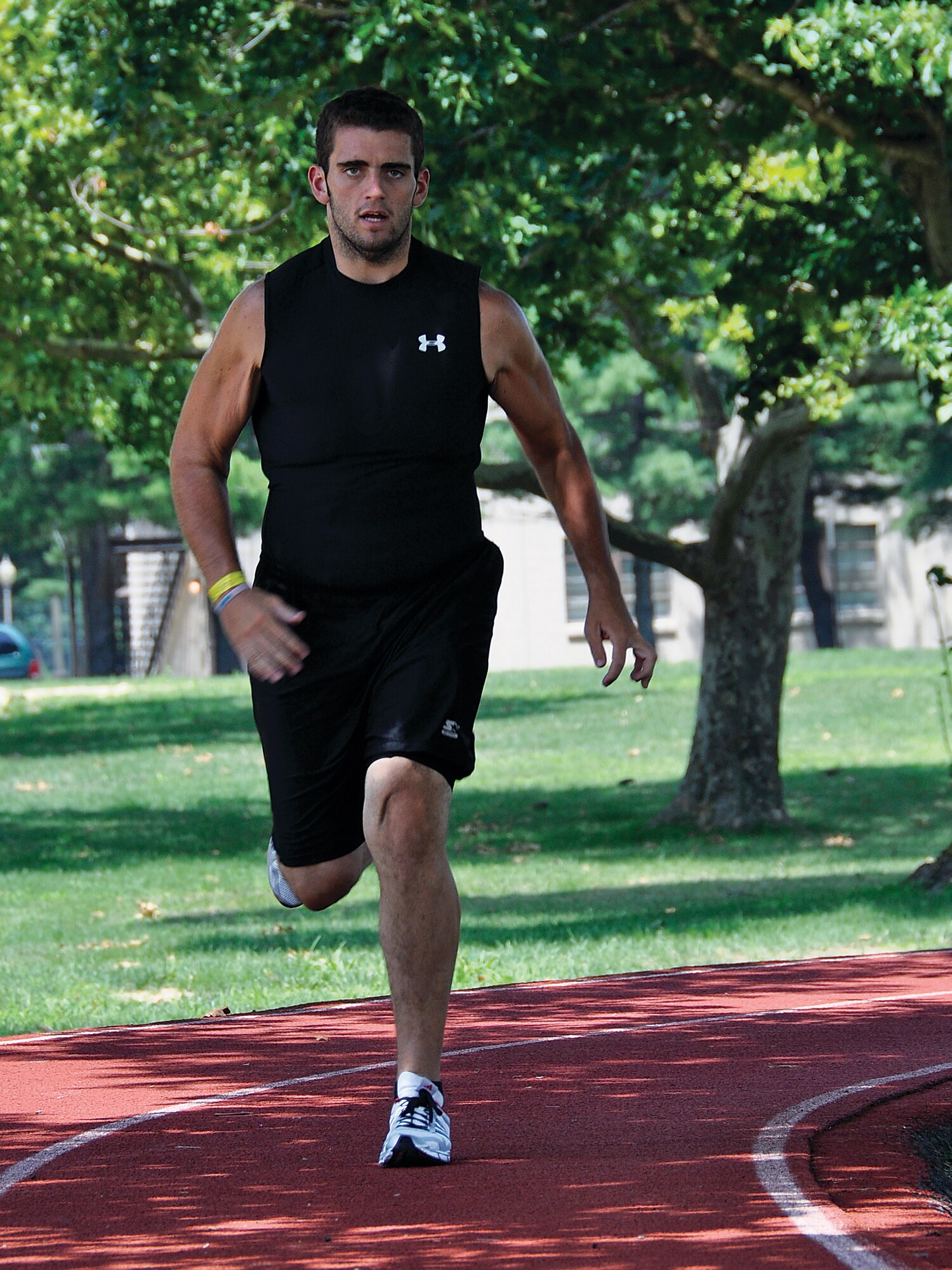 Jared Coty, a student-hire with the 514th Air Mobility Wing safety office, runs the outdoor track near the fitness center here July 11. Coty, who weighed 500 pounds as recently as 2009, now weighs less than 235 pounds. (U.S. Air Force photo/Mr. Shawn J. Jones)