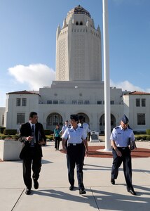 Brig. Gen. Theresa Carter, center, who recently assumed command of the 502nd Air Base Wing, begins an immersion tour of Randolph Air Force Base, Texas on July 25. Escorting her on the tour are Richard Trevino, left, Director 902nd Civil Engineering Squadron, and Col. Scott Peel, Commander 902nd Mission Support Group. (U.S. Air Force photo/Dave Terry)