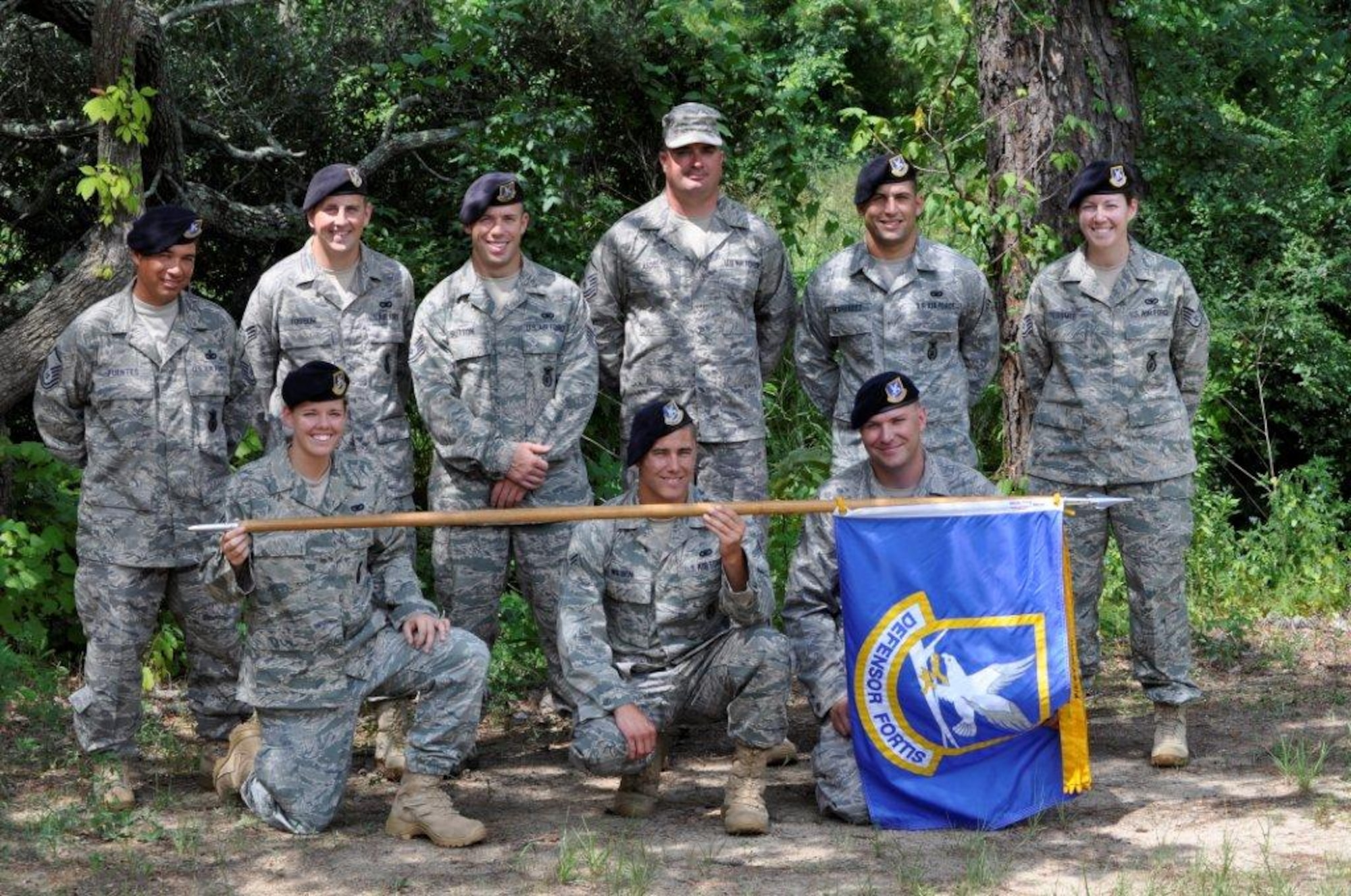 81st Training Wing Security Forces members completed their 148-mile leg of the Air Force Security Forces 9/11 Ruck March to Remember July 24.  Front row from left, Senior Airman Chelsie Mccall, Airman 1st Class Anthony Wilson and Staff Sgt. Nick Tessmer.  Back row from left, Master Sgt. Daniel Fuentes Sr., Senior Airman Brian Fossum, Staff Sgt. Austin Sutton, Master Sgt. Michael Asdel, Senior Airman Christopher Hernandez and Staff Sgt. Shannon Tessmer.  (U.S. Air Force photo by Major Matthew Pignataro)
  
