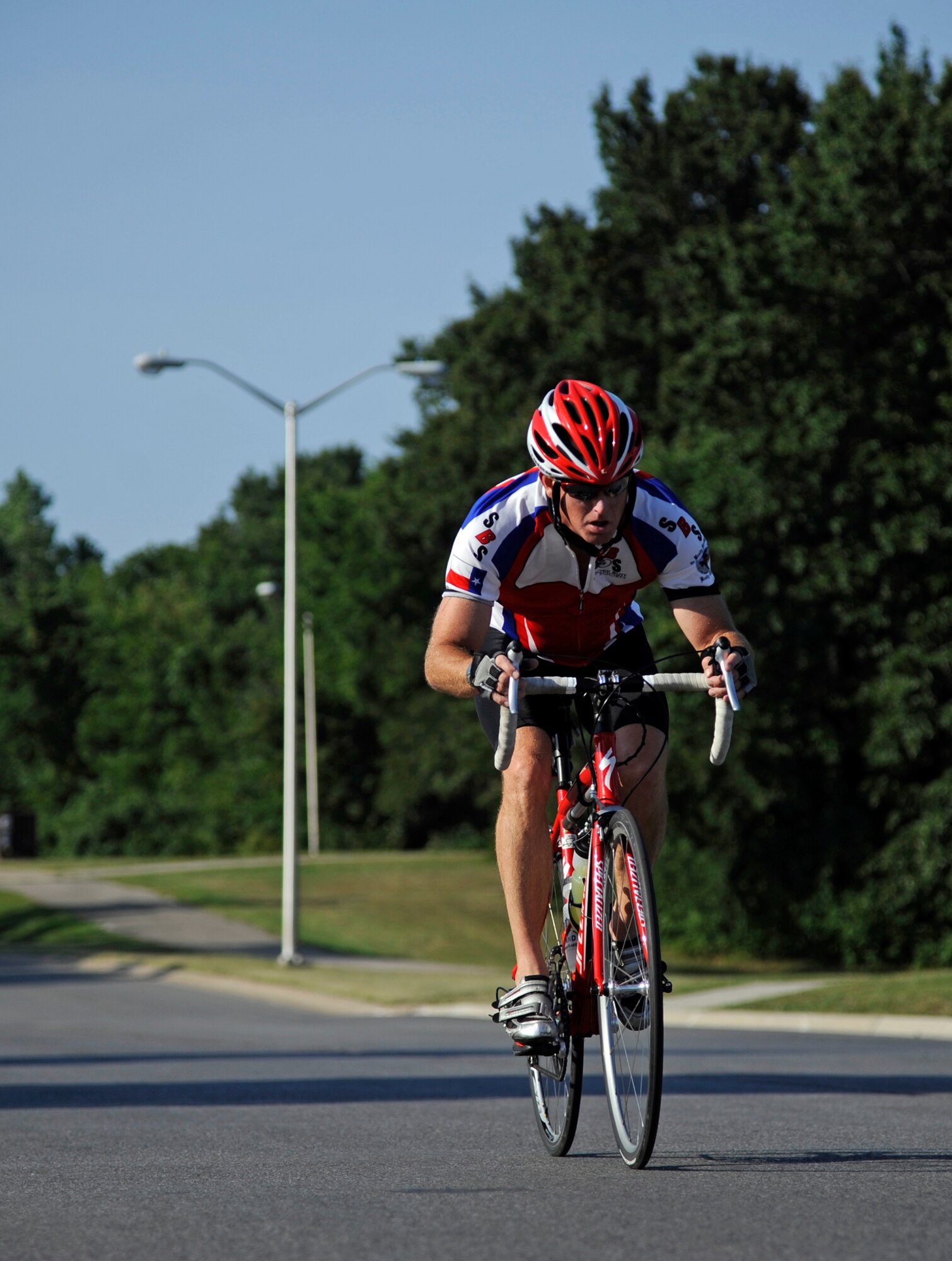 WHITEMAN AIR FORCE BASE, Mo. -- Todd Stewart, 509th Operation Support Squadron, finishes his 6-mile cycling course here July 22, 2011 during the 509th Force Support Squadron's 2011 Triathlon. Mr. Stewart finished in first place in the men-over-40 category with a time of one hour and eight minutes. (U.S. Air Force photo by Airman 1st Class Cody H. Ramirez)