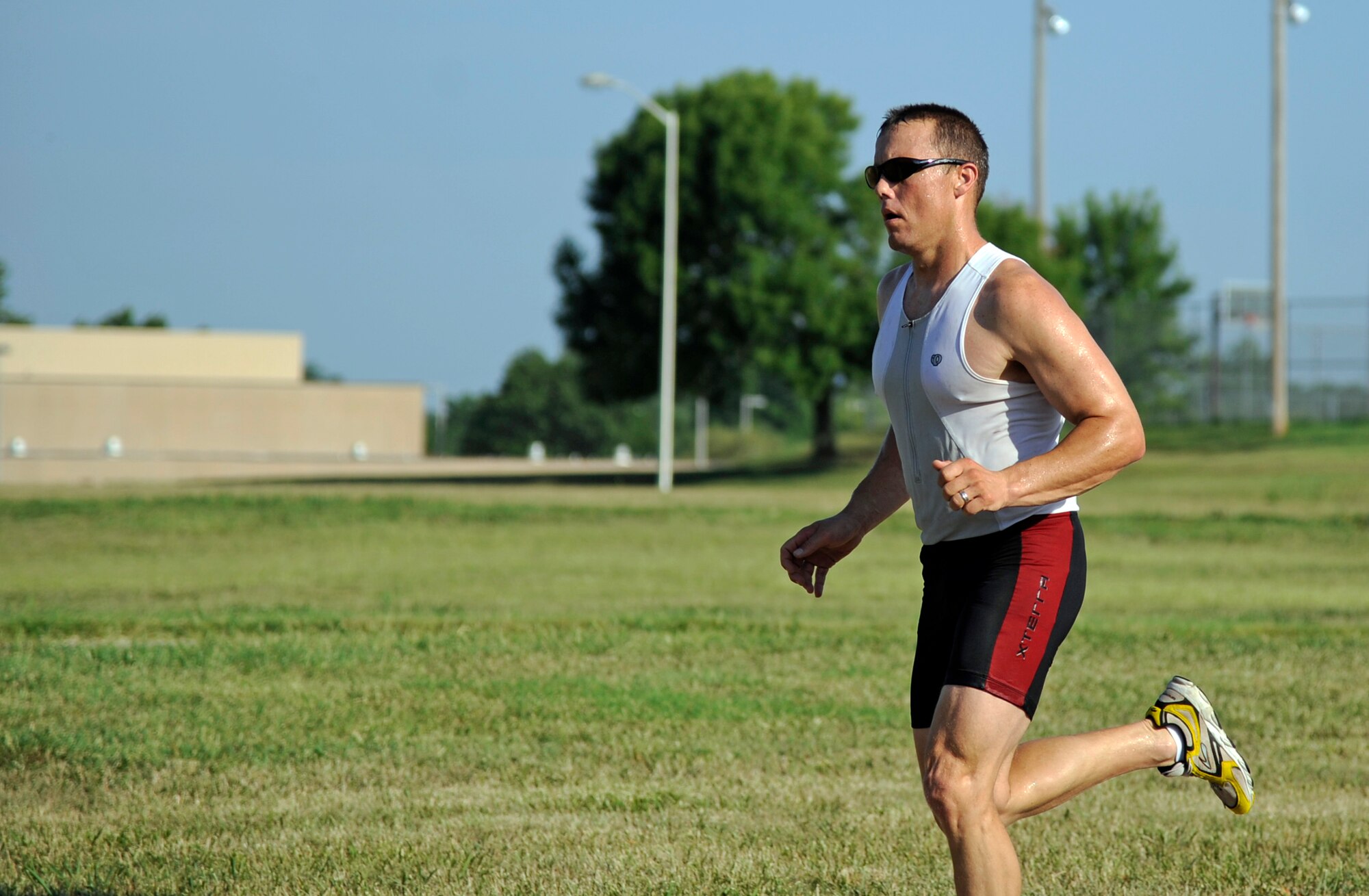 WHITEMAN AIR FORCE BASE, Mo. -- Staff Sgt. Brian Frank, 509th Medical Operations Squadron, maintains a lead during the 3-mile run here July 22, 2011 after swimming 435 meters and cycling 6 miles. Sergeant Frank finished first in the men-under-40 category with a complete time of 48 minutes and 26 seconds.(U.S. Air Force photo by Airman 1st Class Cody H. Ramirez)