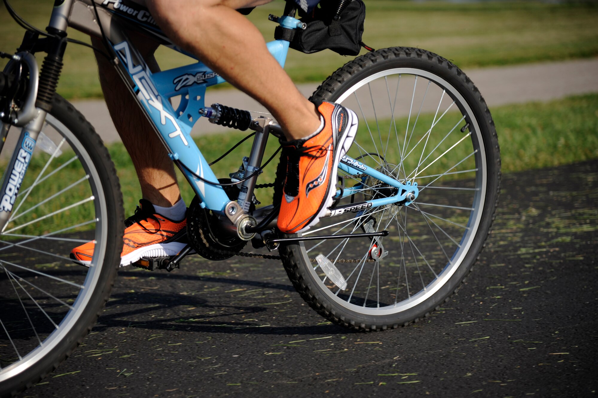 WHITEMAN AIR FORCE BASE, Mo. -- An Airman speeds up on a straight-a-way here July 22, 2011 during the 6-mile cycling course. The bike course was part of the 509th Force Support Squadron 2011 Triathlon.(U.S. Air Force photo by Airman 1st Class Cody H. Ramirez)