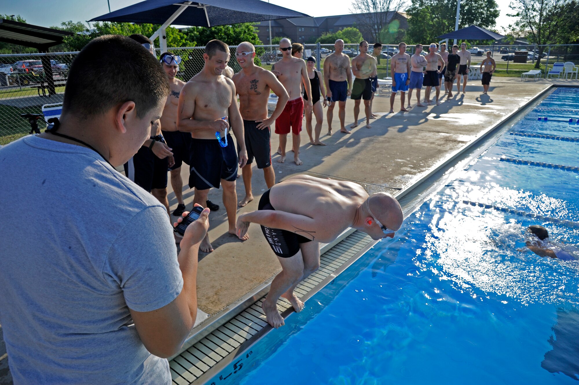 WHITEMAN AIR FORCE BASE, Mo. -- Competitors from around Whiteman line up to start the 509th Force Support Squadron's 2011 Triathlon. The competition started with a 435-meter swim which was followed by a 6-mile cycling course and 3-mile run. (U.S. Air Force photo by Airman 1st Class Cody H. Ramirez)
