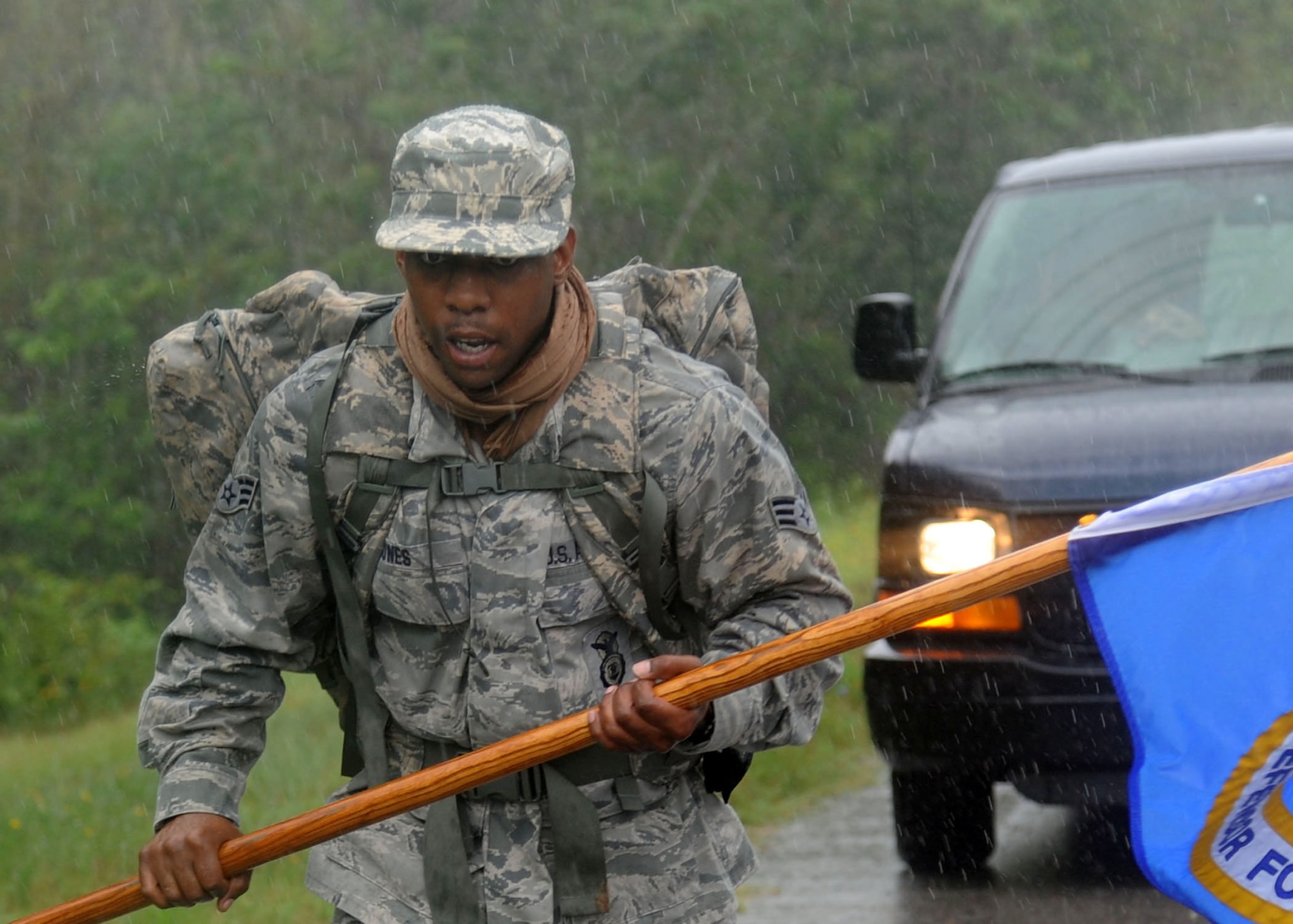 Senior Airmen Chris Jones, 14th Security Forces Squadron member, marches in the rain along Highway 84 near Jonesville, La.,  during the "Ruck March to Remember" commemorating the 10th Anniversary of 9/11. Beginning July 12, Air Force security forces members from 23 units nationwide have volunteered their own time to march 2,181 miles from the Air Force Security Forces Center in San Antonio, Texas past Shanksville, Penn.(where Flight 93 went down) to arrive Sept. 11 at Ground Zero in New York City, NY. (U.S. Air Force by Airman 1st Class Chase Hedrick)