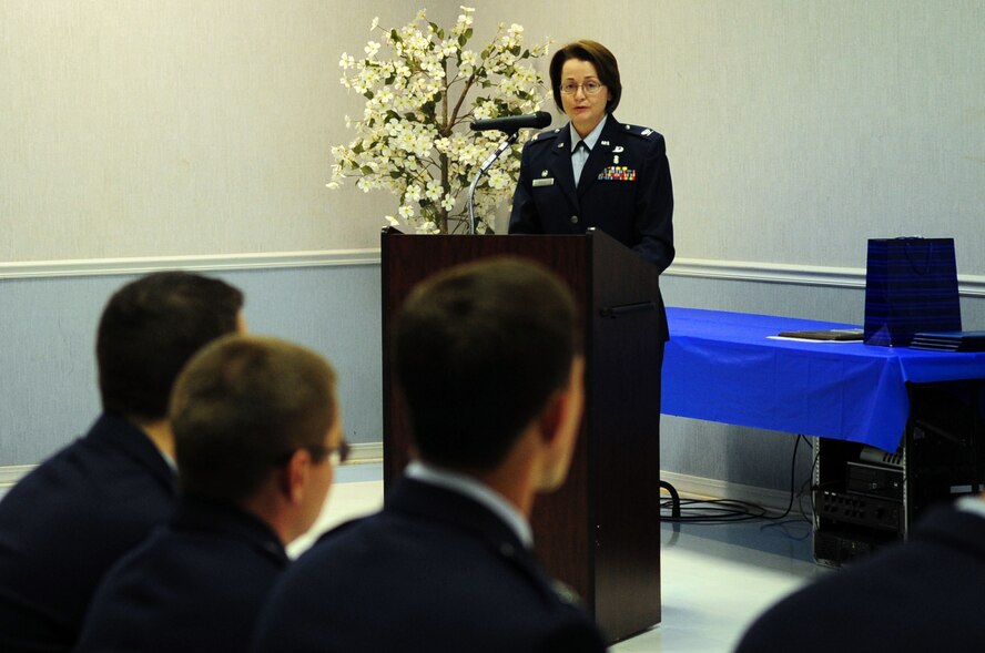 Col. Victoria Farley, 2nd Dental Squadron commander, addresses the graduates of the Advance Education in General Dentistry class of 2011 on Barksdale Air Force Base, La., July 25. Capt. Render Parkman, Capt. Cody Giesler, Capt. Lindsey Merchant, Capt. Nicholas Berns and Capt. Donald Pritchett graduated after completing the competitive one-year post-doctorate residency program. (U.S. Air Force photo/Senior Airman Joanna M. Kresge) 