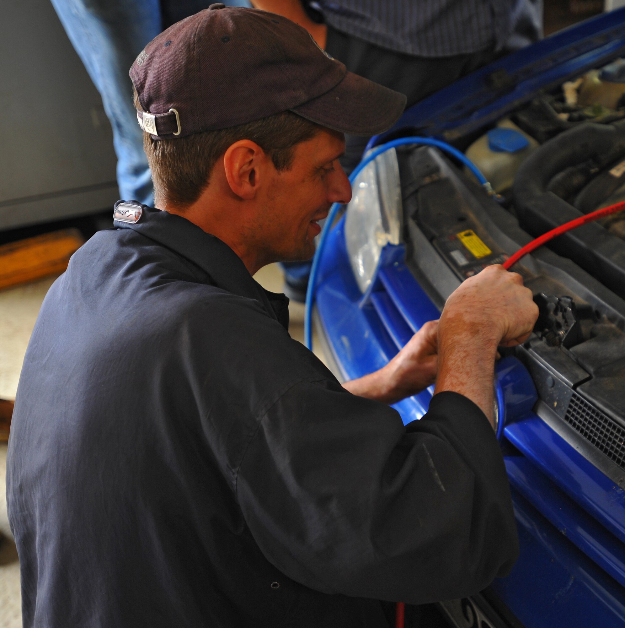 SPANGDAHLEM AIR BASE, Germany – Max Baer, 52nd Force Support Squadron civilian contracted mechanic, takes apart the front grill to view the car’s radiator during an automotive class here July 22. The New England Institute of Technology sent an instructor here to teach a five day advanced automotive class for Spangdahlem and Ramstein Air Base FSS automotive mechanics. (U.S Air Force photo/Airman 1st Class Dillon Davis)